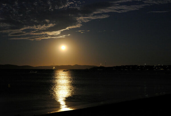 The moon rises over the island of Porquerolles